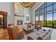 Clubhouse lobby area featuring a fireplace, large windows, and comfortable seating at 7879 S Zante Ct, Aurora, CO 80016