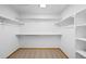 Walk-in closet with ample shelving and carpet at 7879 S Zante Ct, Aurora, CO 80016