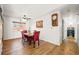 Dining area featuring wood floors, bright lighting, and comfortable seating at 13225 W Jewell Cir, Lakewood, CO 80228