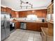 Well-equipped kitchen with stainless steel appliances and ample cabinet space at 13225 W Jewell Cir, Lakewood, CO 80228