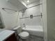 Bathroom featuring tiled shower/tub and vanity at 3613 S Sheridan Blvd # 16, Denver, CO 80235