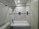 Bathroom featuring tiled shower/tub at 3613 S Sheridan Blvd # 16, Denver, CO 80235
