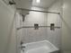 Bathroom featuring tiled shower/tub at 3613 S Sheridan Blvd # 16, Denver, CO 80235