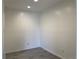 A spacious bedroom with neutral walls and gray wood-look flooring at 3613 S Sheridan Blvd # 16, Denver, CO 80235