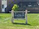 Entrance sign welcoming you to The Bear Valley Club with building directory information at 3613 S Sheridan Blvd # 16, Denver, CO 80235