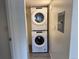 Convenient in-unit laundry area features a stacked washer and dryer for efficient space saving at 3613 S Sheridan Blvd # 16, Denver, CO 80235