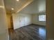 Spacious living room with wood-look floors and natural light at 3613 S Sheridan Blvd # 16, Denver, CO 80235