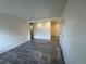 Open living room featuring neutral walls and gray wood-look flooring at 3613 S Sheridan Blvd # 16, Denver, CO 80235