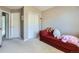 Bedroom featuring carpet flooring, neutral colored walls, and a closet for optimal storage at 6426 Silver Mesa Dr # C, Highlands Ranch, CO 80130