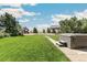 Spacious backyard with a hot tub and playground nearby at 402 S County Road 129, Bennett, CO 80102