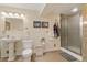 Basement bathroom with pedestal sink, toilet and shower at 402 S County Road 129, Bennett, CO 80102