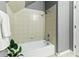 Simple bathroom with shower/tub combo and tile at 402 S County Road 129, Bennett, CO 80102