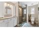 Modern bathroom with a large walk-in shower and updated vanity at 402 S County Road 129, Bennett, CO 80102