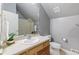 Clean bathroom with single sink vanity and toilet at 402 S County Road 129, Bennett, CO 80102