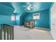 Charming bedroom with teal walls and crib at 402 S County Road 129, Bennett, CO 80102