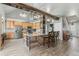 Open concept kitchen with large island and breakfast bar, wooden cabinets at 402 S County Road 129, Bennett, CO 80102