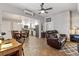 Open concept living room and kitchen with a view into the kitchen at 402 S County Road 129, Bennett, CO 80102