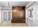 Mudroom with abundant built-in storage, bench seating, neutral wall colors, and tile floor at 402 S County Road 129, Bennett, CO 80102