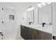 Modern double vanity bathroom with sleek cabinetry and contemporary lighting at 1256 Newton St # 1, Denver, CO 80204