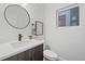 Simple, modern bathroom with a floating vanity at 1256 Newton St # 1, Denver, CO 80204