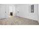 Bright bedroom with neutral carpeting and ample natural light at 1256 Newton St # 1, Denver, CO 80204