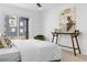 Bright bedroom with sliding door to balcony and modern decor at 1256 Newton St # 1, Denver, CO 80204