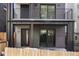 Townhouse with private patio and modern dark brick facade at 1256 Newton St # 1, Denver, CO 80204