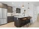 Modern kitchen with island and stainless steel appliances at 1256 Newton St # 1, Denver, CO 80204