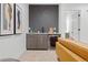 Basement wet bar with modern cabinetry and wine cooler at 1256 Newton St # 1, Denver, CO 80204