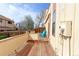 View of the wood back deck, perfect for outdoor relaxation and entertaining, with a brightly colored chair at 8917 E Chenango Ave, Greenwood Village, CO 80111