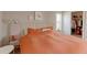Bright bedroom features neutral walls, carpeted floor, a queen bed, and a closet at 8917 E Chenango Ave, Greenwood Village, CO 80111