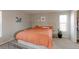Bright bedroom features neutral walls, carpeted floor, a queen bed, and a closet at 8917 E Chenango Ave, Greenwood Village, CO 80111
