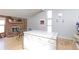 Kitchen and dining area featuring a fireplace and bright windows at 8917 E Chenango Ave, Greenwood Village, CO 80111