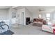 Comfortable living area with large windows and neutral carpet at 8917 E Chenango Ave, Greenwood Village, CO 80111