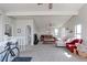 Inviting living room featuring vaulted ceilings, bright windows, and comfortable seating arrangement at 8917 E Chenango Ave, Greenwood Village, CO 80111