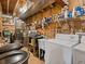 Utility area with a washing machine, utility sink, shelving, and storage bins at 451 Harris Dr, Idaho Springs, CO 80452