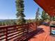 Spacious deck offers panoramic mountain views, creating a serene setting for relaxation and outdoor living at 451 Harris Dr, Idaho Springs, CO 80452