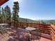 Outdoor deck with mountain views, perfect for relaxing and enjoying the serene natural surroundings at 451 Harris Dr, Idaho Springs, CO 80452