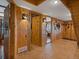 Inviting wood paneled entryway with tiled floors and decorative light fixtures at 451 Harris Dr, Idaho Springs, CO 80452