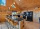 Kitchen with granite island and seating at 451 Harris Dr, Idaho Springs, CO 80452