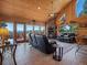 Cozy living room with a stone fireplace and scenic views at 451 Harris Dr, Idaho Springs, CO 80452