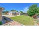 Exterior view of a detached garage and spacious yard with picnic table at 505 Empire St, Aurora, CO 80010