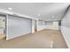 Spacious finished basement with neutral carpet, white trim, and ample room for recreation and storage at 505 Empire St, Aurora, CO 80010