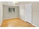 Cozy bedroom with hardwood floors, a neutral color scheme, and a bright window at 505 Empire St, Aurora, CO 80010
