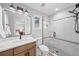 Contemporary bathroom with a glass shower, modern vanity, and stylish black fixtures at 7050 S Polo Ridge Dr, Littleton, CO 80128