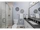 Modern bathroom with a glass-enclosed shower, vanity, and stylish fixtures at 7050 S Polo Ridge Dr, Littleton, CO 80128