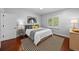 Comfortable bedroom with a neutral color scheme, minimalist decor, and natural light at 7050 S Polo Ridge Dr, Littleton, CO 80128