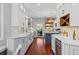 Spacious kitchen featuring a large island, ample counter space, and views of the outdoor living area at 7050 S Polo Ridge Dr, Littleton, CO 80128