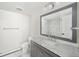 Bright bathroom featuring a marble countertop, modern vanity, and neutral wall color at 39 Sedgwick Dr, Cherry Hills Village, CO 80113