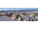 Stunning aerial view of the community with picturesque snow-capped mountains in the distance on a sunny day at 145 Kettle Valley Way, Monument, CO 80132